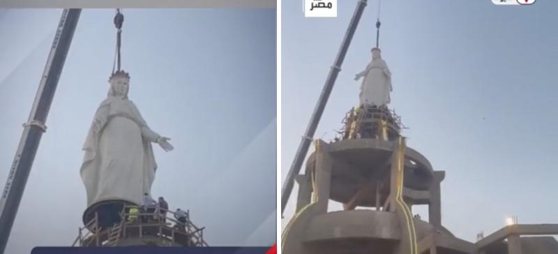 لحظة تعليق تمثال السيدة العذراء 