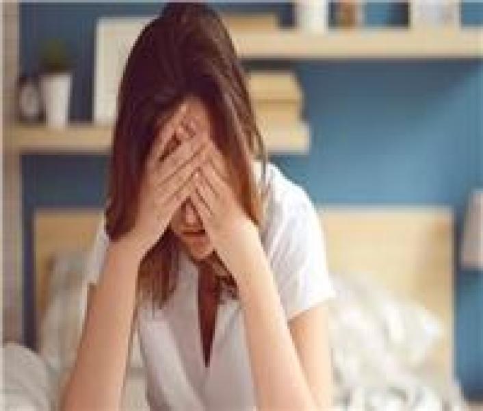 تعبيرية عن تضرر سيدة 