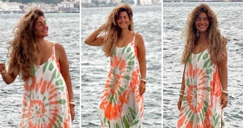 منة فضالي بفستان صيفي أنيق على البحر