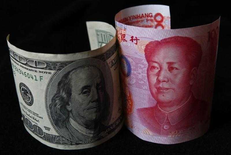 تراجع سعر اليوان الصيني أمام الدولار لأدنى مستوى منذ 18 عامًا