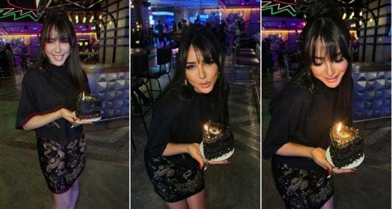 بتورتة سوداء وعين زرقاء.. ساندي تحتفل بعيد ميلادها مع أصدقائها
