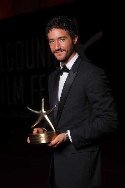 أحمد مالك يحصد نجمة الجونة لأفضل ممثل عن فيلم «كولونيا» ويهديها لمصر